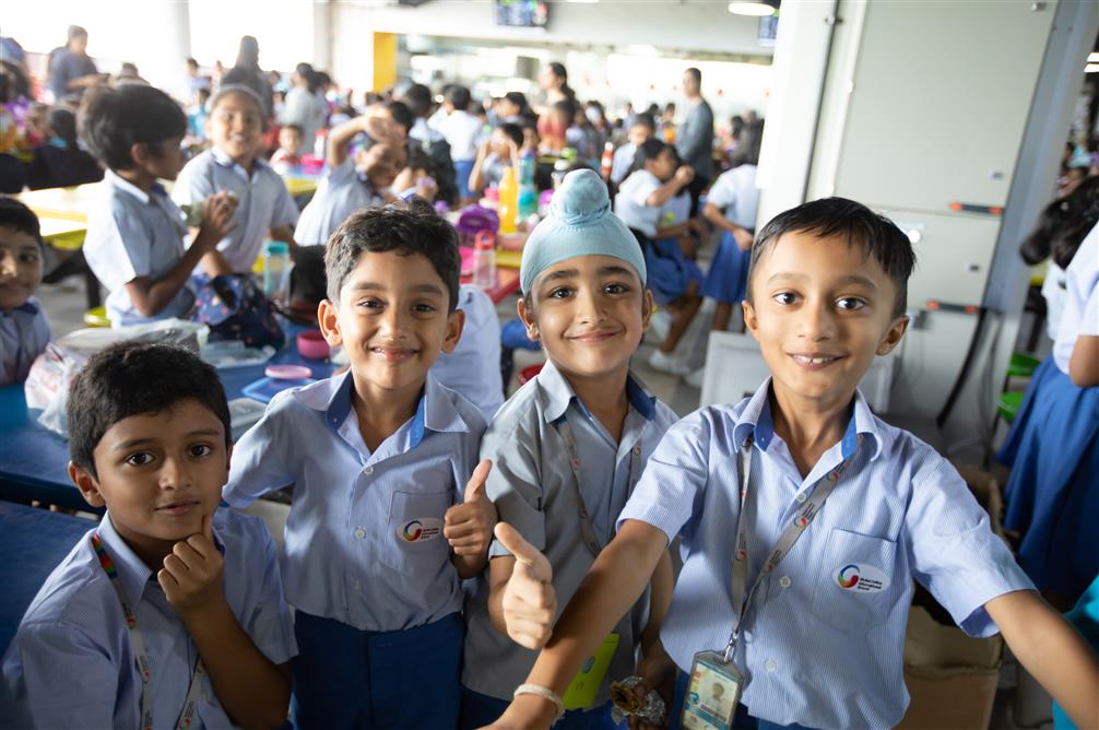 Primary students show a thumbs up at the GIIS SMART Campus 