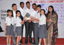 The winning team of GIIS Chinchwad with Grandmaster Mr. Abhijeet Kunte, Amrita Vohra, Principal GIIS Chinchwad, and the sports coaches