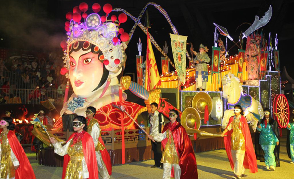 GIIS students walk alongside the Cantonese Opera themed float