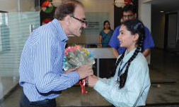 Student of GIIS Surat welcoming Mr. Nilam Mankad, Principal, Mahatma Gandhi Global Indian Eklavya School