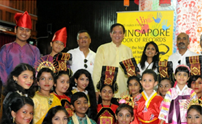 MP Mr Charles Chong surrounded by 
children
