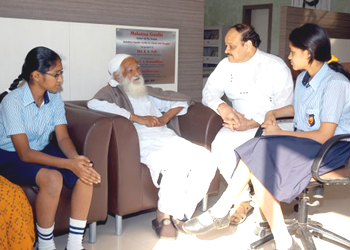 The philanthropist interacting with the students