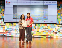 Ms Meenakshi Mehta receives the certificate awarded by The Singapore Book of Records