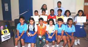 Mr Winston and Ms Melissa with all the Quiz participants and winners